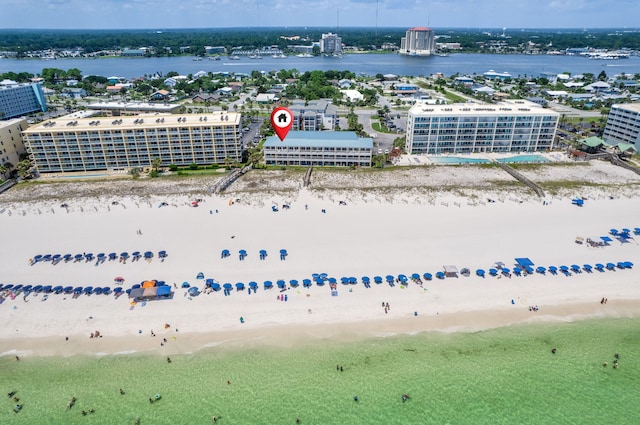 birds eye view of property with a city view, a beach view, and a water view