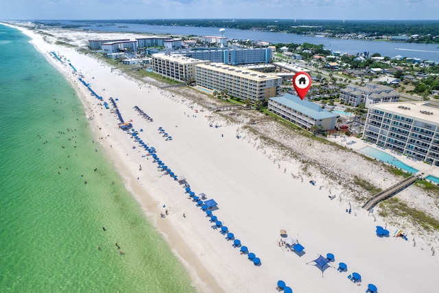 birds eye view of property with a view of city, a beach view, and a water view