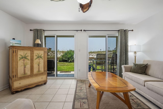 living room with baseboards and light tile patterned floors