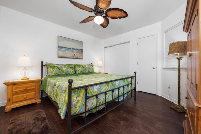 bedroom with dark wood-style floors, baseboards, and a ceiling fan