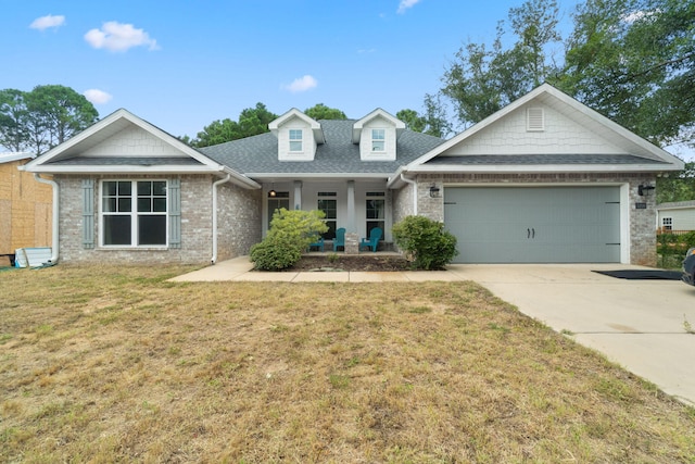 view of front of home featuring concrete driveway, roof with shingles, an attached garage, and a front yard