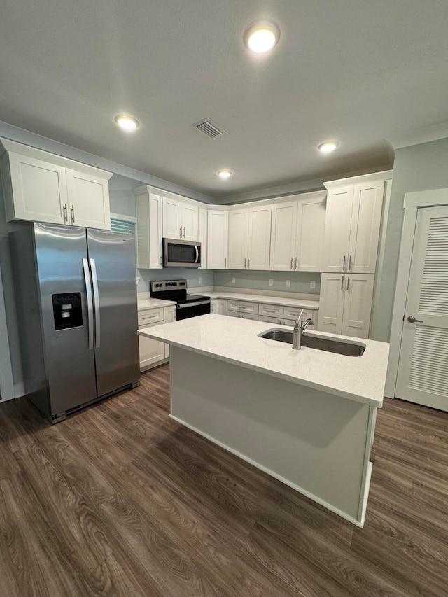 kitchen featuring sink, stainless steel appliances, dark wood-type flooring, and white cabinetry