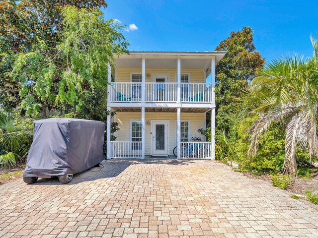 view of front of home featuring a balcony