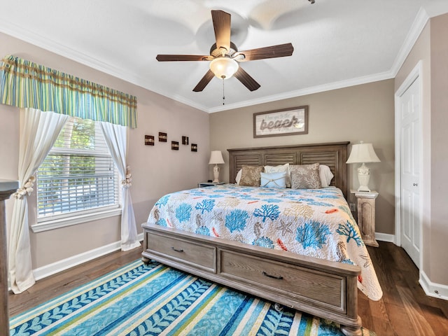 bedroom featuring dark wood-style flooring, crown molding, baseboards, and ceiling fan