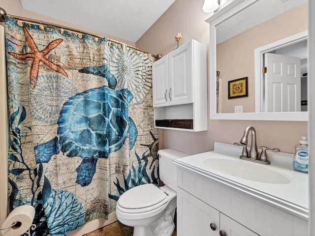 full bathroom with toilet, tile patterned flooring, a textured ceiling, and vanity