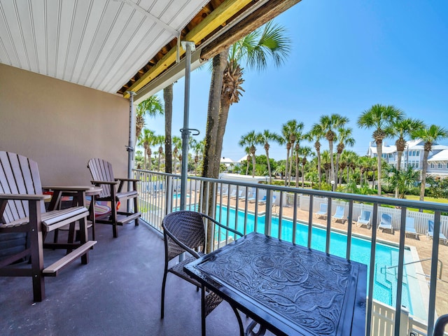 balcony featuring a community pool