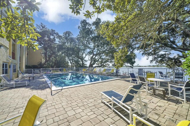 view of swimming pool featuring a patio area