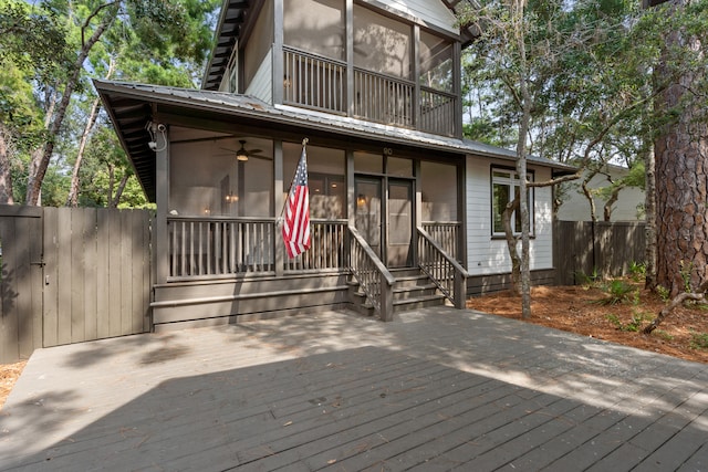 exterior space featuring ceiling fan