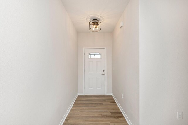 doorway to outside with hardwood / wood-style floors