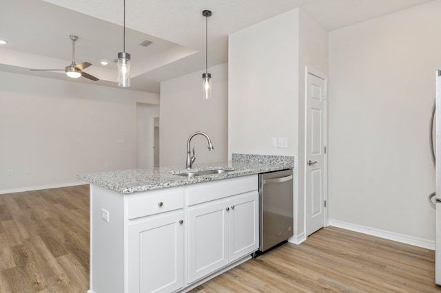 kitchen with light hardwood / wood-style floors, stainless steel dishwasher, a raised ceiling, white cabinets, and ceiling fan