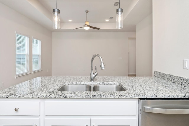 kitchen with ceiling fan, sink, white cabinetry, and dishwasher