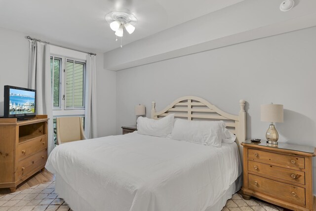 bedroom featuring ceiling fan and light hardwood / wood-style flooring