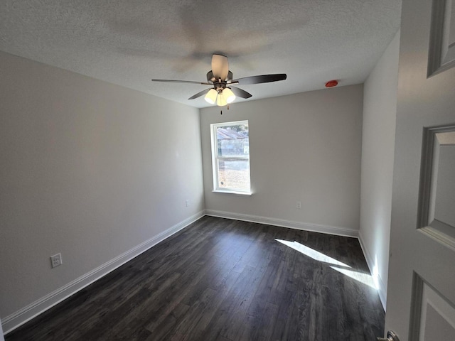 unfurnished room featuring ceiling fan, dark hardwood / wood-style floors, and a textured ceiling