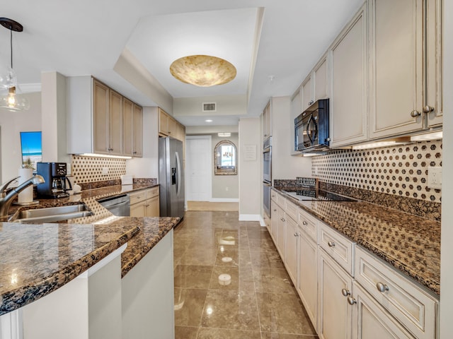 kitchen featuring visible vents, backsplash, a sink, dark stone countertops, and black appliances