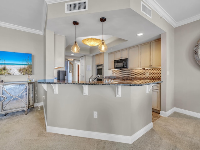 kitchen featuring black microwave, a breakfast bar area, light carpet, and visible vents