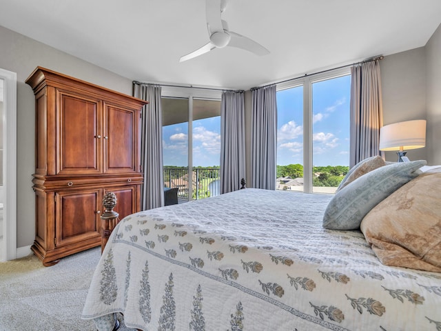 bedroom with a ceiling fan, access to outside, and light carpet