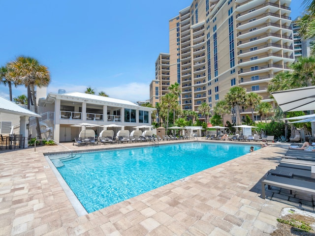 community pool featuring a patio area