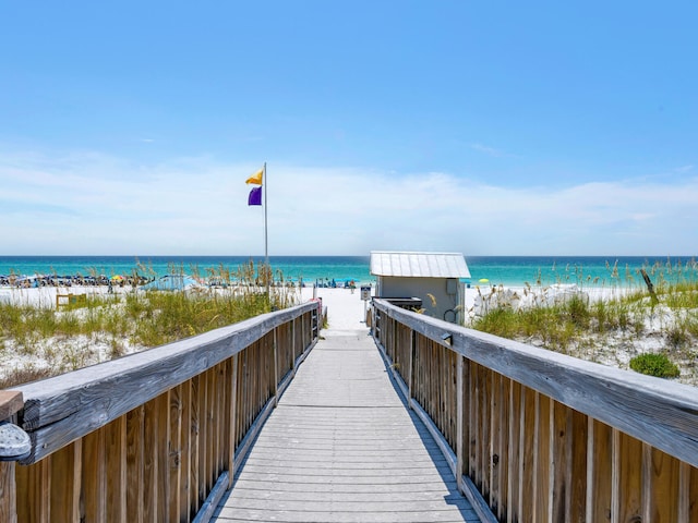 view of property's community with a view of the beach and a water view