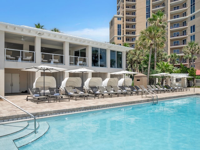 community pool with a patio area