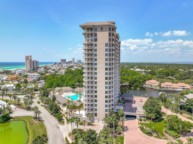 view of building exterior featuring a view of city and a water view