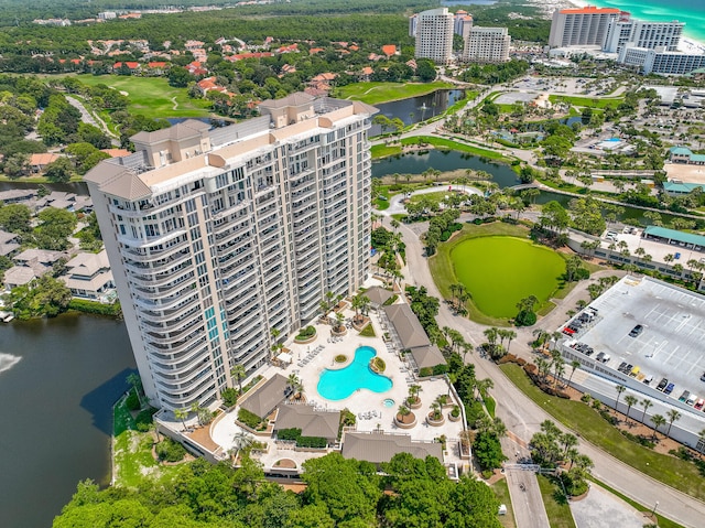 birds eye view of property with a water view and a city view