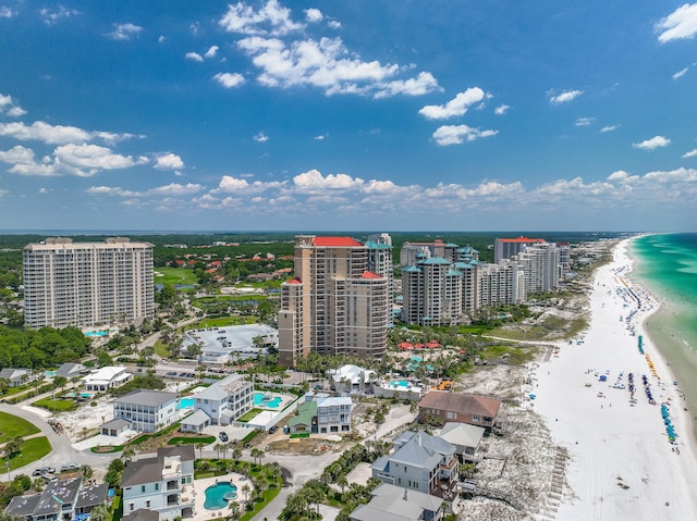 birds eye view of property with a city view, a water view, and a beach view