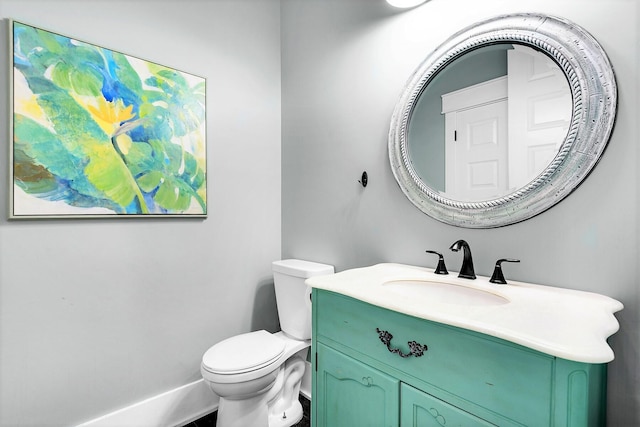 bathroom with toilet and vanity