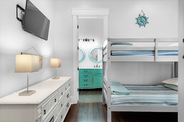 bedroom featuring dark wood finished floors