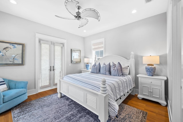 bedroom featuring access to outside, baseboards, recessed lighting, and wood finished floors