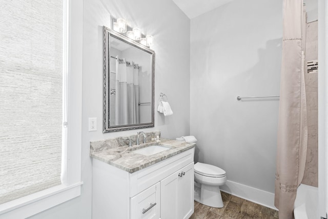 bathroom with a shower with curtain, baseboards, toilet, and wood finished floors