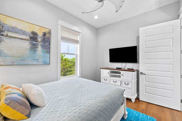 bedroom featuring ceiling fan and light wood-type flooring