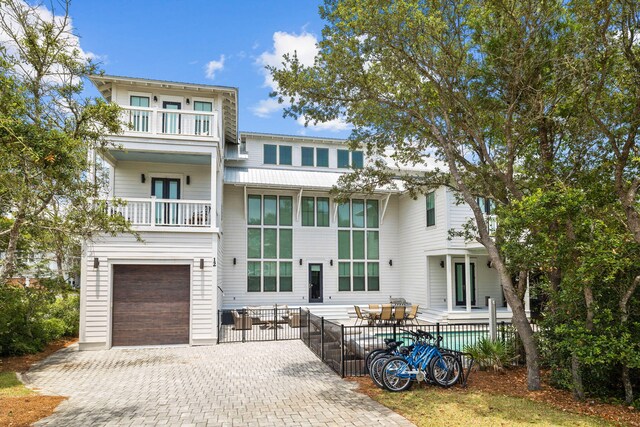 exterior space featuring a balcony and a garage