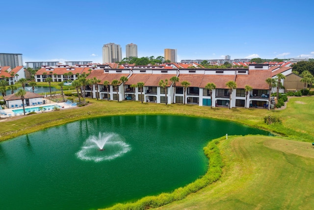 exterior space with a lawn and a water view