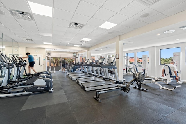 workout area featuring a drop ceiling