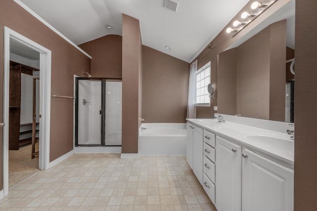 bathroom featuring baseboard heating, vanity, shower with separate bathtub, and vaulted ceiling