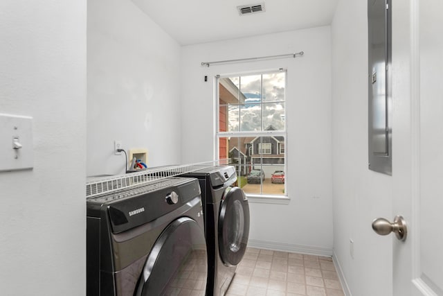 laundry area with independent washer and dryer and plenty of natural light