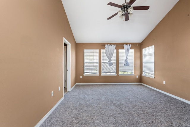 unfurnished room with ceiling fan, carpet flooring, and vaulted ceiling