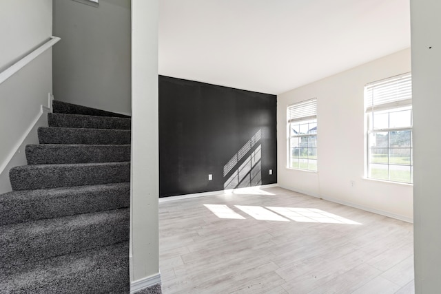 stairway featuring wood-type flooring