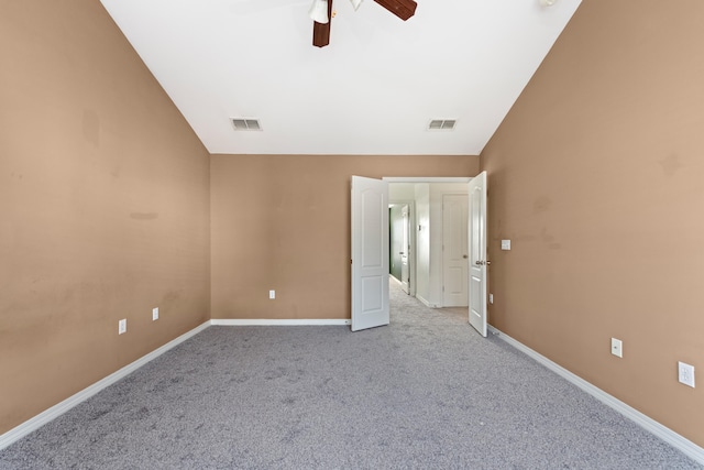 unfurnished room with vaulted ceiling, light carpet, and ceiling fan