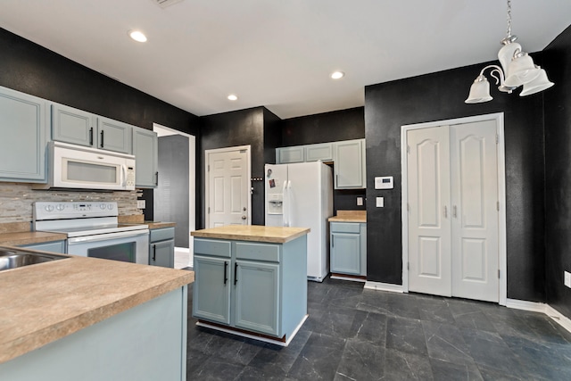 kitchen with white appliances, sink, wood counters, decorative light fixtures, and decorative backsplash