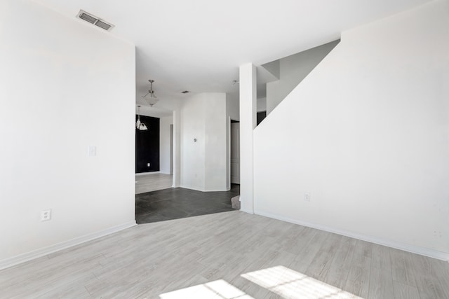 spare room featuring hardwood / wood-style floors