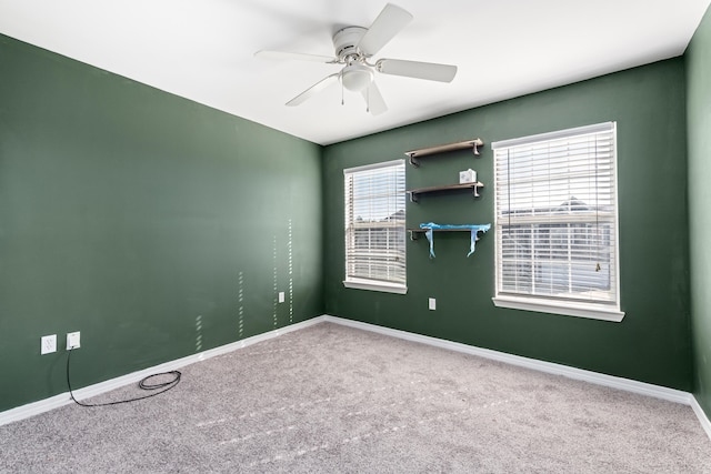 carpeted empty room with ceiling fan