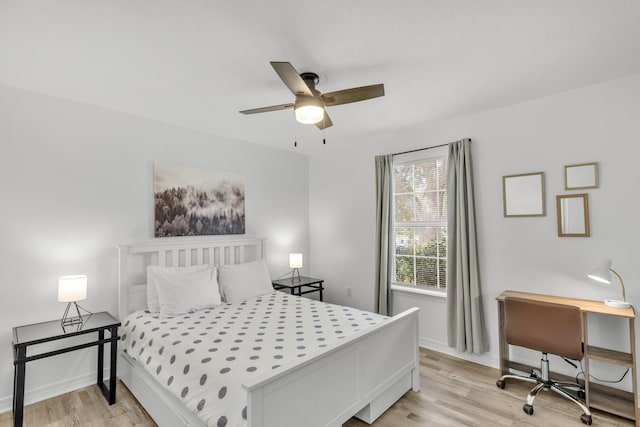 bedroom with ceiling fan and light hardwood / wood-style flooring