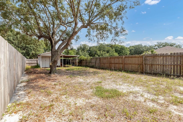 view of yard with a storage unit