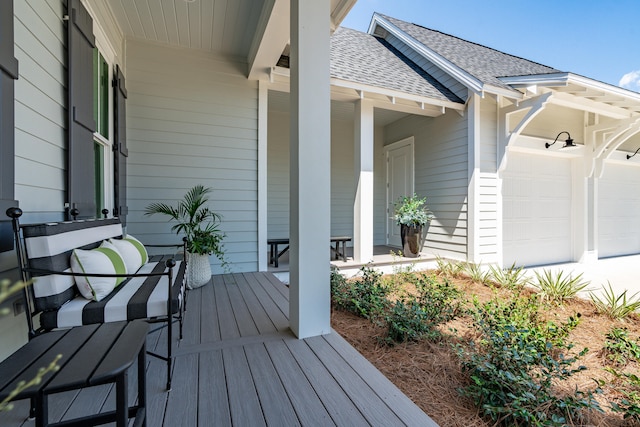 wooden deck with a garage