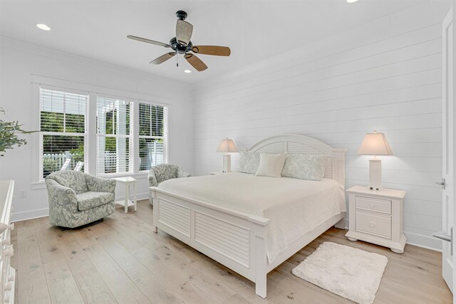 bedroom with ceiling fan and light hardwood / wood-style flooring