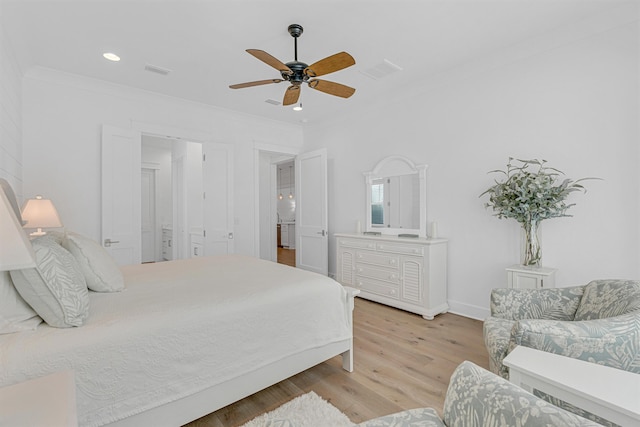 bedroom with crown molding, recessed lighting, visible vents, light wood-style floors, and baseboards