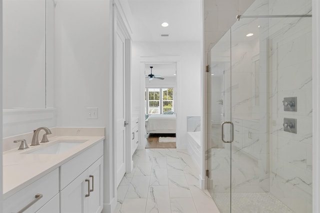 bathroom featuring tile patterned floors, a shower with shower door, vanity, and ceiling fan