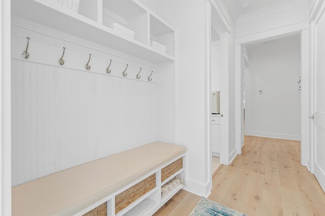 mudroom with light hardwood / wood-style flooring