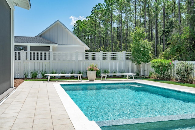 view of swimming pool with a fenced in pool and a fenced backyard